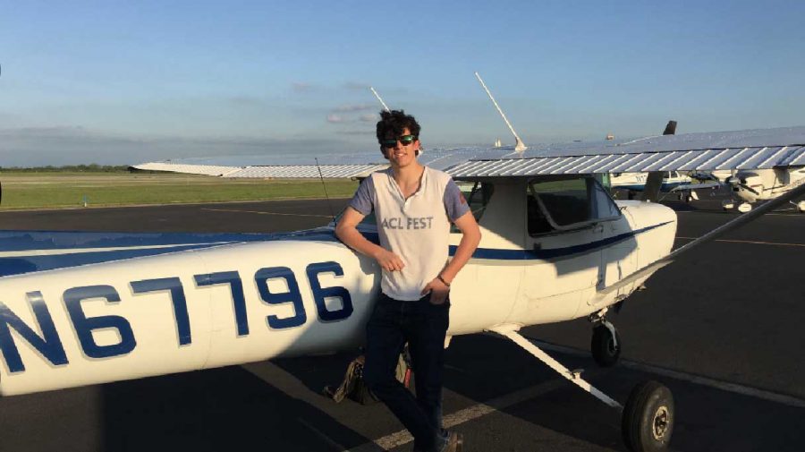 Max poses next to one of the aircraft he practiced flying in for his license. 