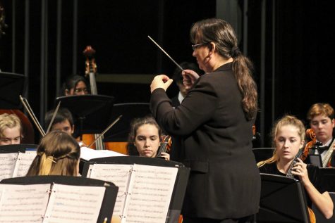 Orchestra director Ana Maria Solis conducts the piece “Allegro in D for Strings” with the philharmonic and recital orchestras. 
