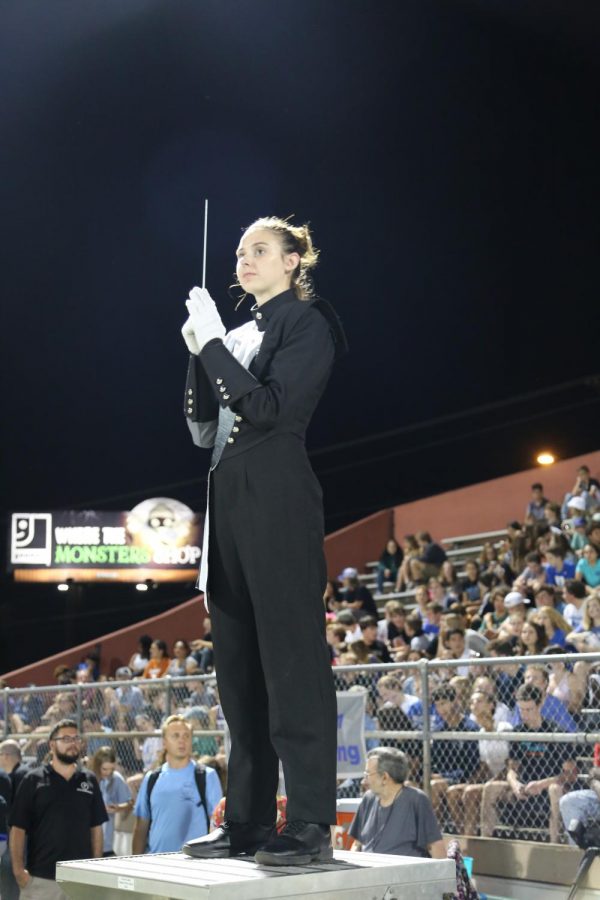 Drum Major Hannah Walls begins to conduct the halftime show at the Austin vs McCallum varsity football game. 