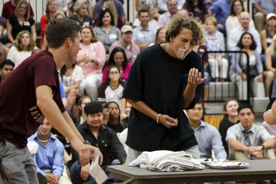 Senior Djavan Ploetz-Aponte competes in the whip cream bubble gum challenge at the first pep rally. 
