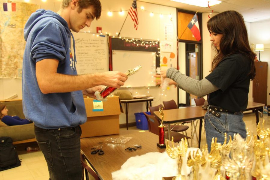 Seniors Patrick Survis and Sebe Shearer prepare trophies for the tournament. This event is hosted at Austin high and is co run by the Model UN classes.