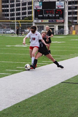 Erin Collins tries to get the ball before the defender. “They were very aggressive but we played well,” Collins said.