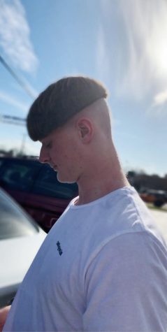 Junior Ben Woodhouse shows off his fresh cut after losing in Fantasy Football. “When I first went through with it, I didn’t really know what to think, I just got used to it after a while,” Woodhouse said.